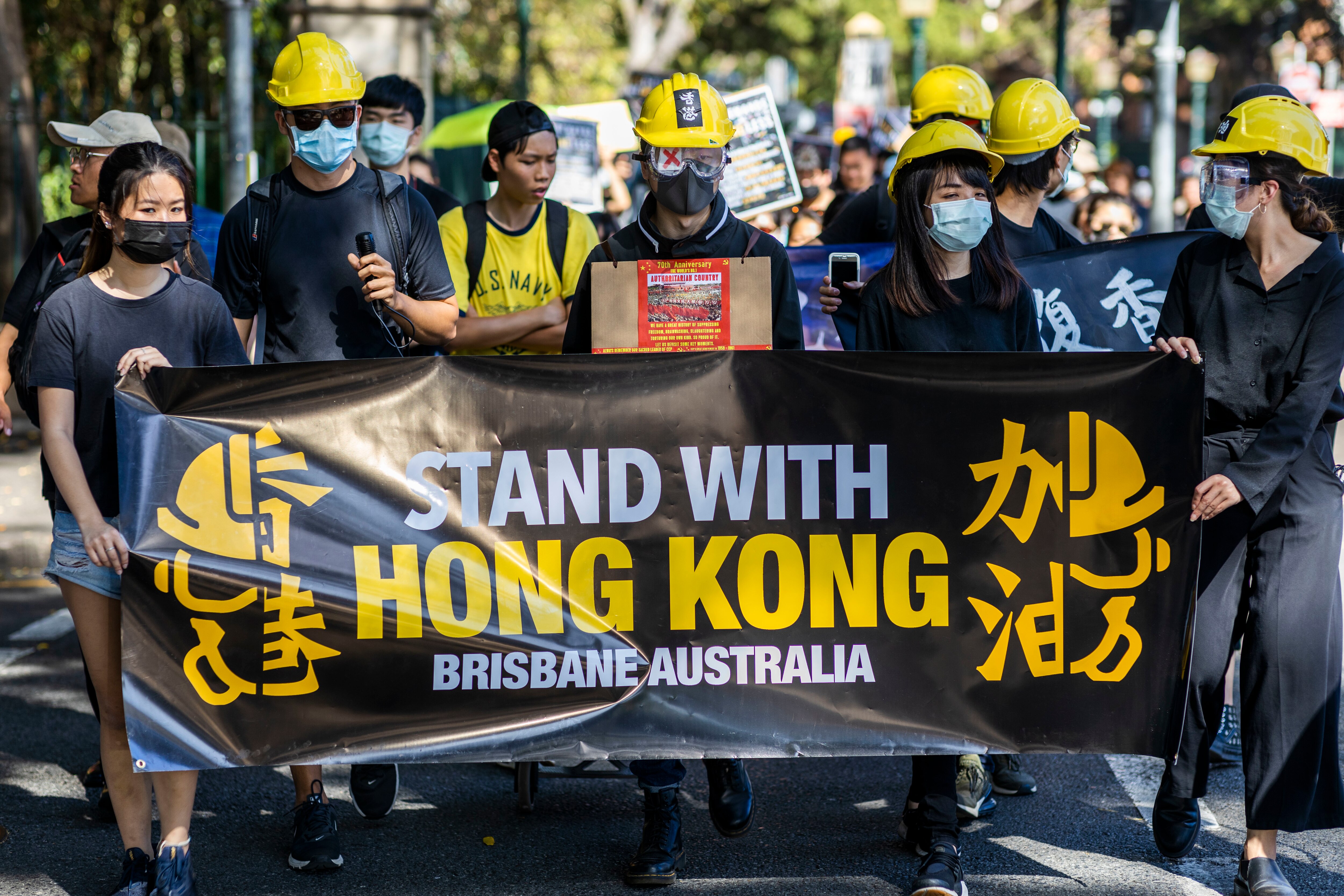 Hong Kong pro-democracy supporters hold a demonstration in Brisbane, Sunday, September 29, 2019. (AAP Image/Glenn Hunt) NO ARCHIVING