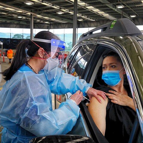 A drive through patient gets vaccinated at the new western health drive through COVID-19 vaccination centre in Melton, Sunday, August 8, 2021. 
