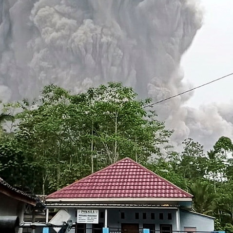 Mount Semeru spews volcanic ash during an eruption in Lumajang, East Java, 4 December 2021. 