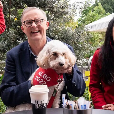 Leader of the Australian Labor Party Anthony Albanese (C) meets with Labor candidate for Reid, Sally Sitou (R) and supporters after winning the federal election at Marrickville Library and Pavilion in Sydney on 22 May, 2022.