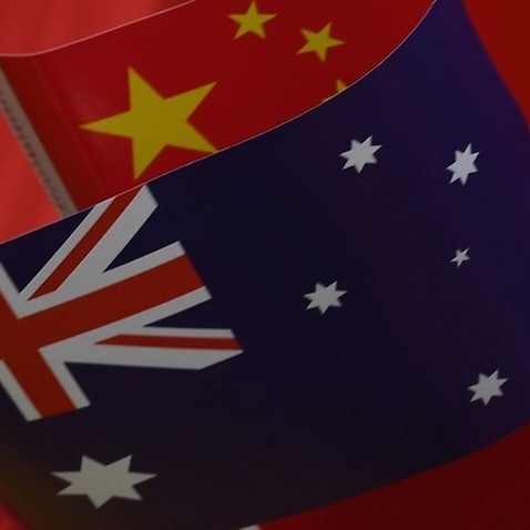 Flags of Australia and China.