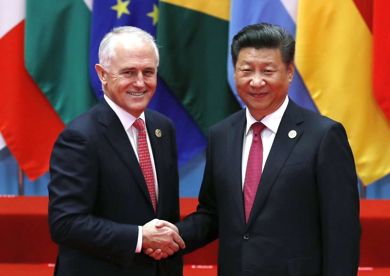 Australia's Prime Minister Malcolm Turnbull, left, shakes hands with China's President Xi Jinping.