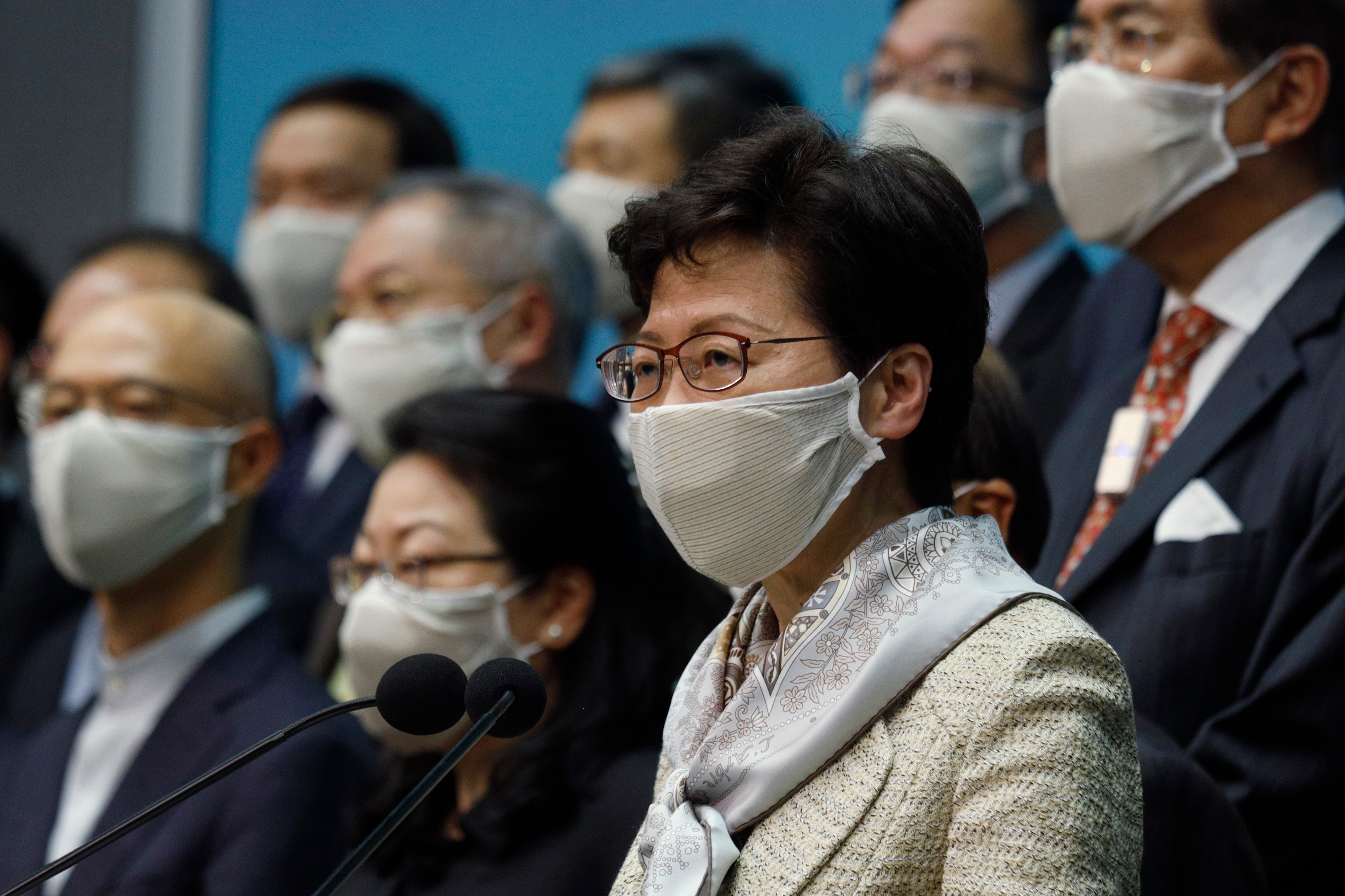 Hong Kong Chief Executive Carrie Lam, center, and other officials attend a press conference in Hong Kong after returning from China's NPC meeting. Hong Kong Chief Executive Carrie Lam, center, and other officials attend a press conference in Hong Kong after returning from China's NPC meeting.