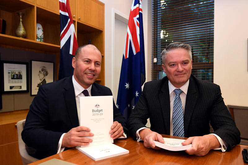 Treasurer Josh Frydenberg poses for a photograph with Minister for Finance Mathias Cormann with the 2019 Budget.