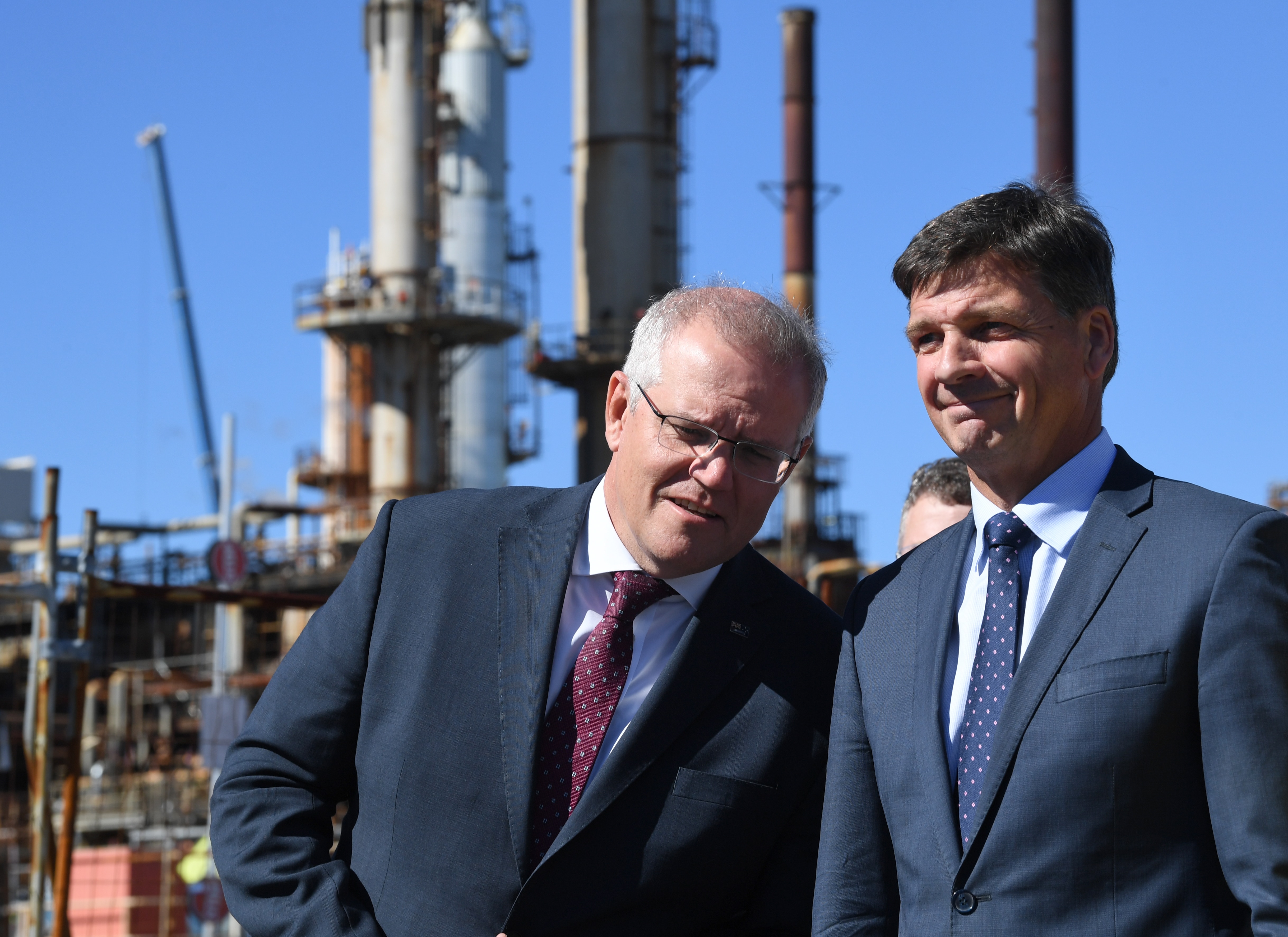 Scott Morrison (left) and Energy Minister Angus Taylor (right) during a tour of the Ampol Lytton Refinery in Brisbane, Monday, 17 May, 2021. 