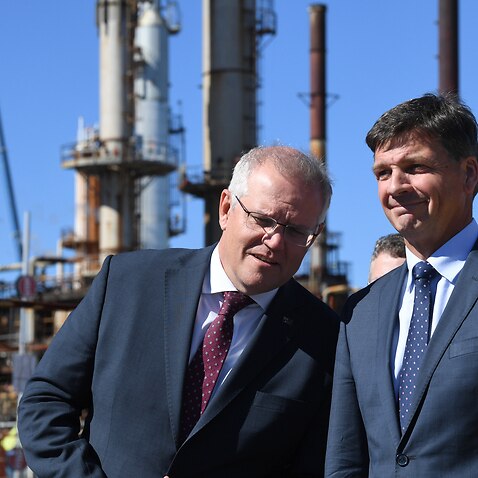Scott Morrison (left) and Energy Minister Angus Taylor (right) during a tour of the Ampol Lytton Refinery in Brisbane, Monday, 17 May, 2021. 