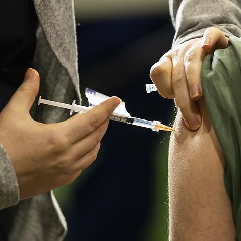 A person receives a COVID-19 vaccine in Melbourne.