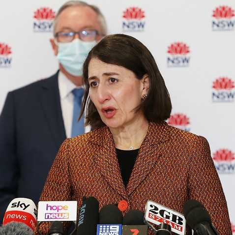 NSW Premier Gladys Berejiklian speaks to the media with NSW Health Minister Brad Hazzard during a press conference in Sydney, Monday, 26 July, 2021. 