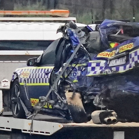 Four police officers have died in a crash involving a truck on Melbourne's Eastern Freeway.