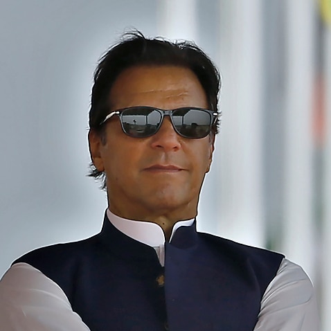 Pakistan's Prime Minister Imran Khan attends a military parade to mark Pakistan National Day, in Islamabad, Pakistan, Wednesday, March 23, 2022.