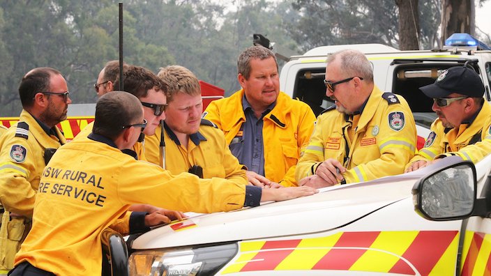 Rural Fire Service Deputy Dave Ryan (second right) prepares firefighters to tackle a bushfire at Gospers Mountain near Putty, north-west of Sydney.