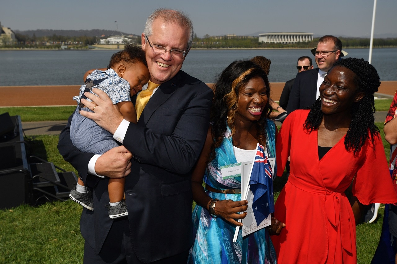 Prime Minister Scott Morrison poses for photos with new citizens during an Australia Day Citizenship Ceremony and Flag Raising event in Canberra. Prime Minister Scott Morrison poses for photos with new citizens during an Australia Day Citizenship Ceremony and Flag Raising e