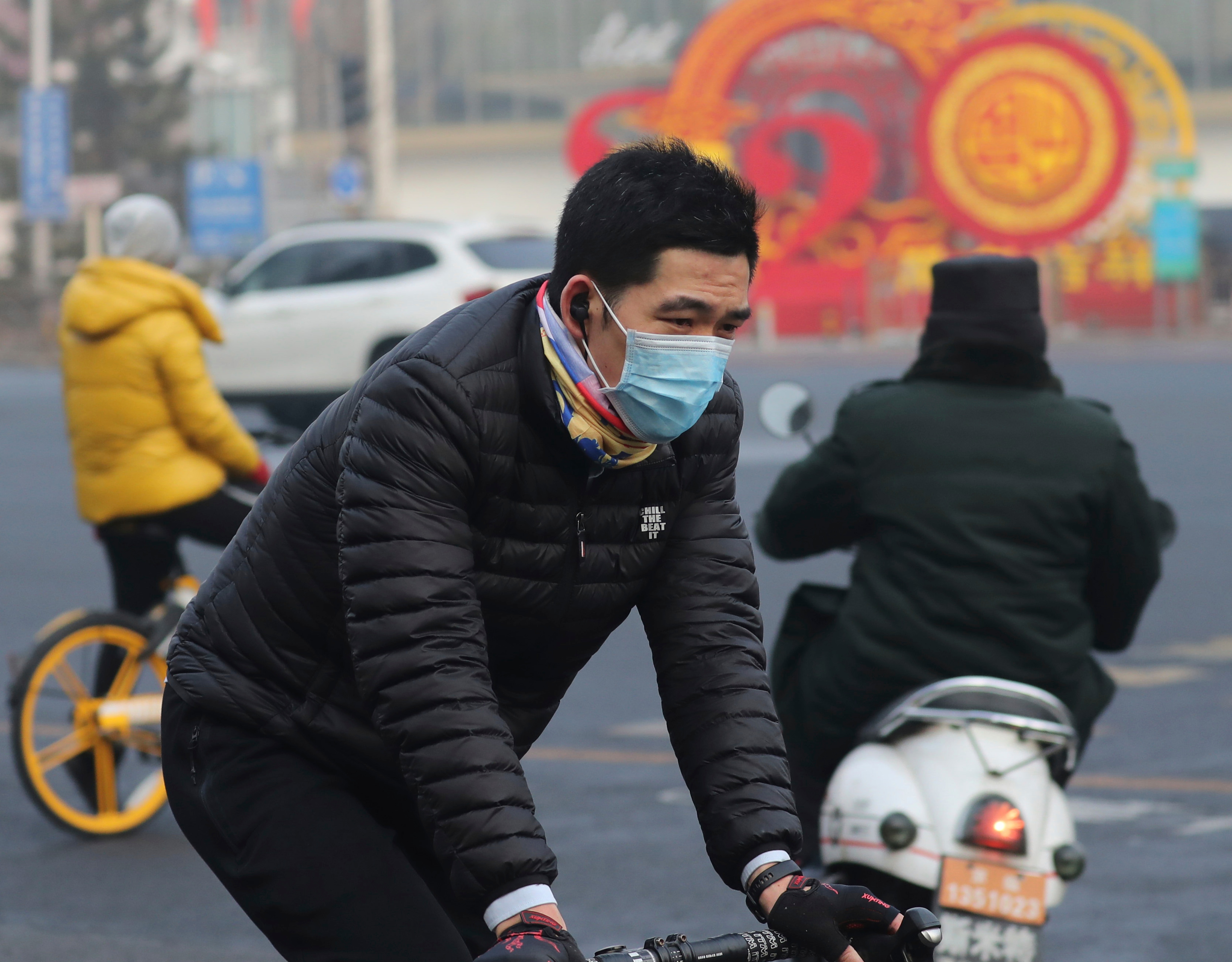 A man wears a mask in Beijing. The virus has spilled over China’s borders and spread to at least 25 countries worldwide.
