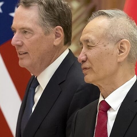 U.S. Trade Representative Robert Lighthizer, left, listens as Chinese Vice Premier Liu He 