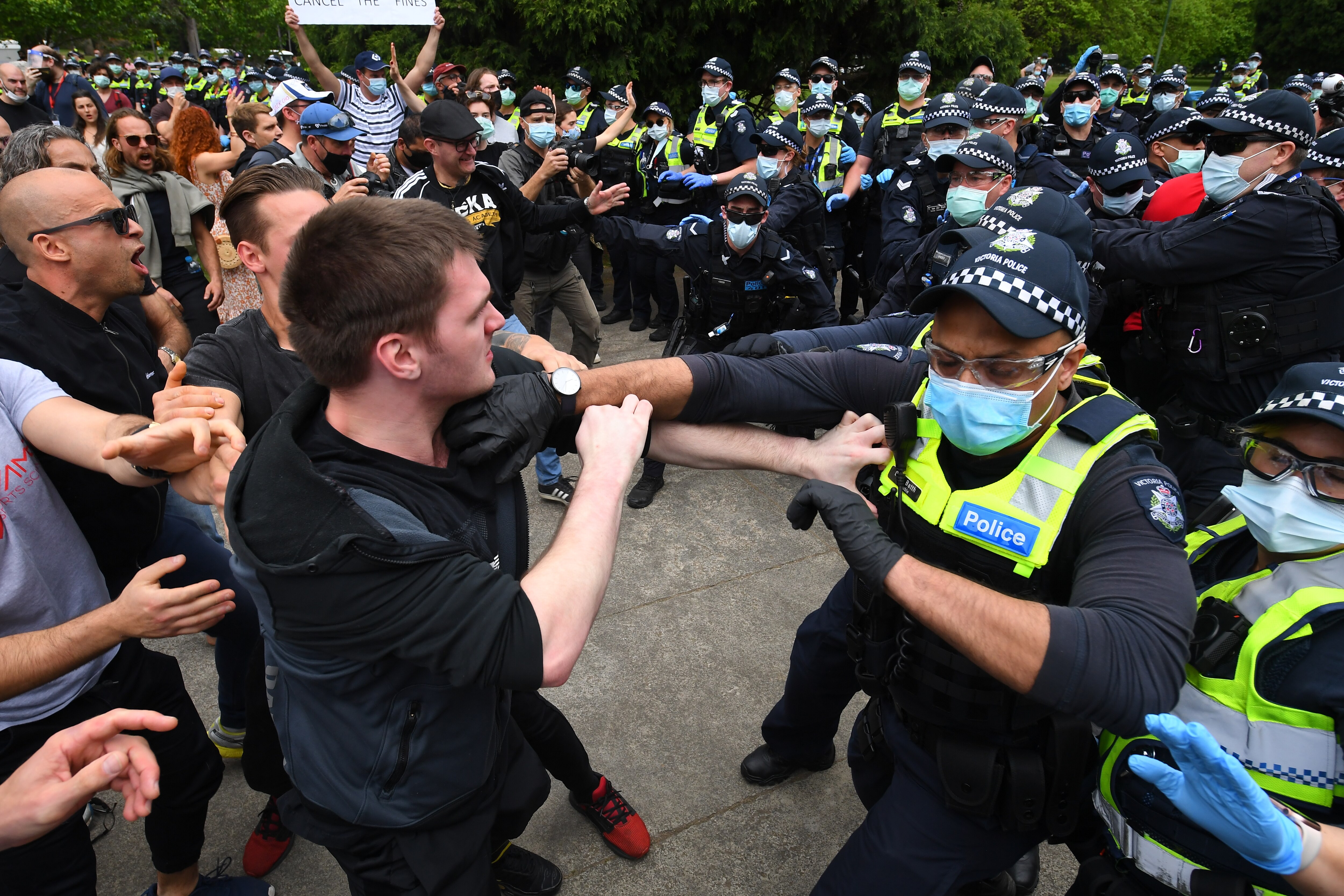 Protesters are seen during an anti-lockdown protest in Melbourne on 23 October.