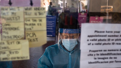 A health specialist works at a COVID-19 testing site in Los Angeles on 9 December, 2020.