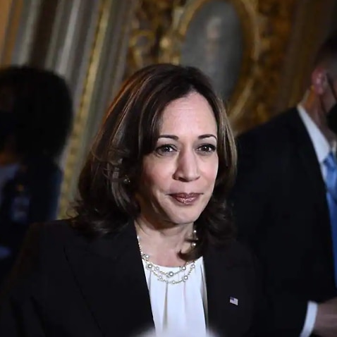 US Vice President Kamala Harris speaks to reporters while departing the Senate Chamber at the US Capitol in Washington, DC.