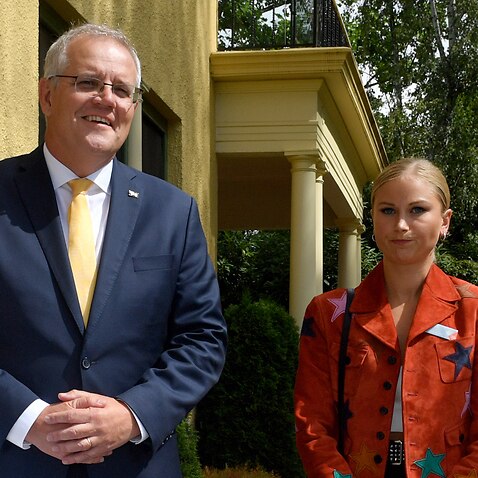 Prime Minister Scott Morrison and 2021 Australian of the Year Grace Tame during a morning tea held at The Lodge in Canberra.