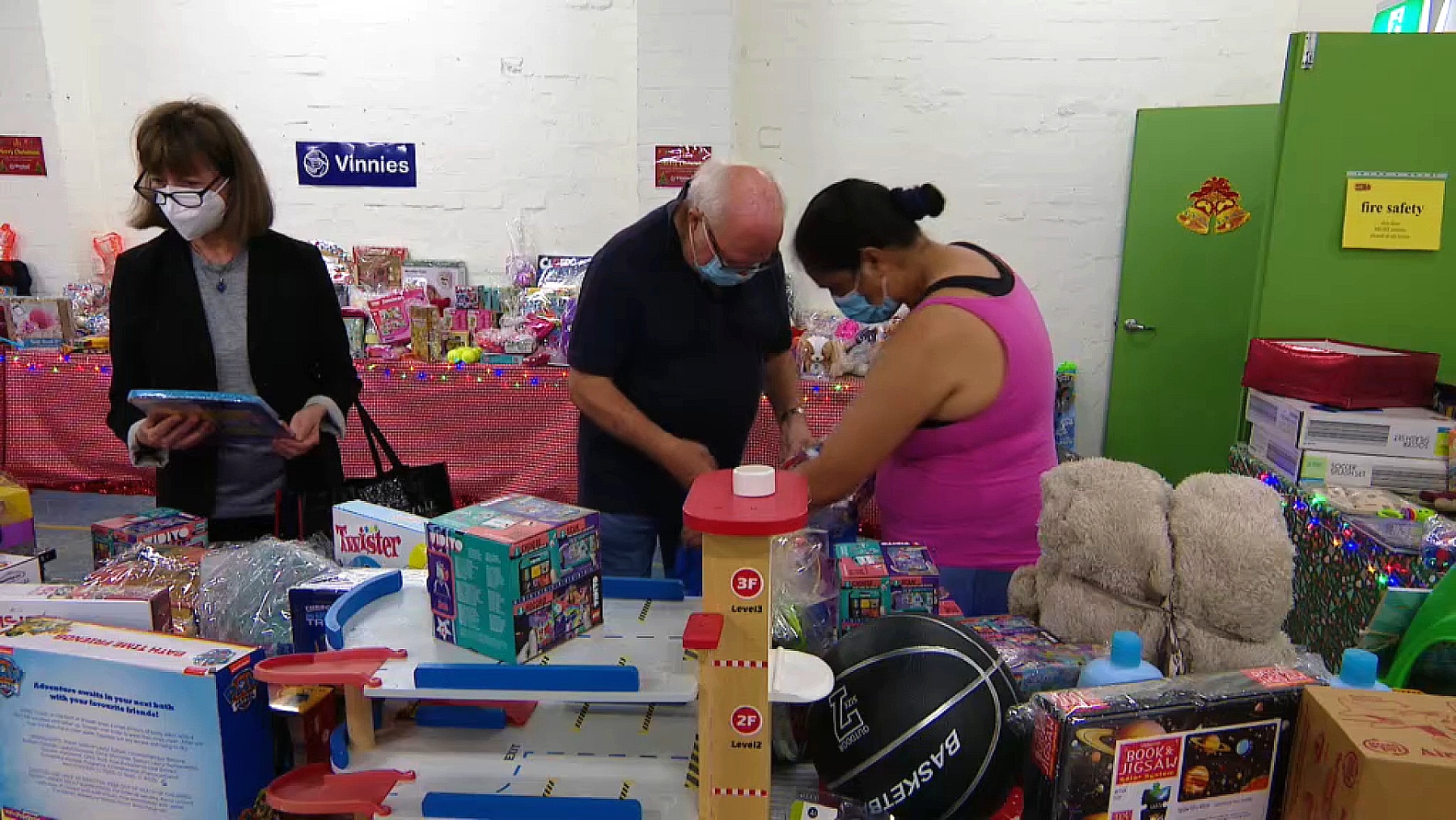 Vinnies volunteers working on Christmas gifts (SBS)
