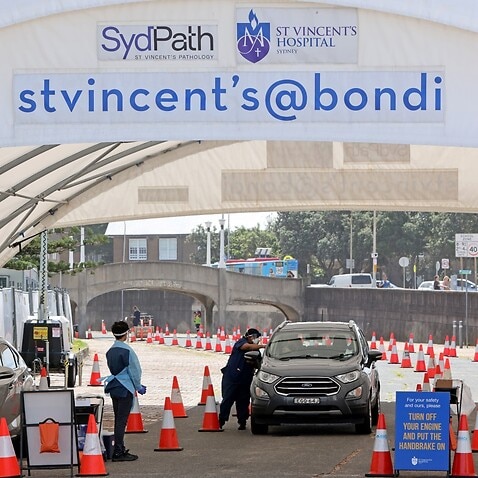 People are tested for COVID-19 at a drive through facility in Sydney. 