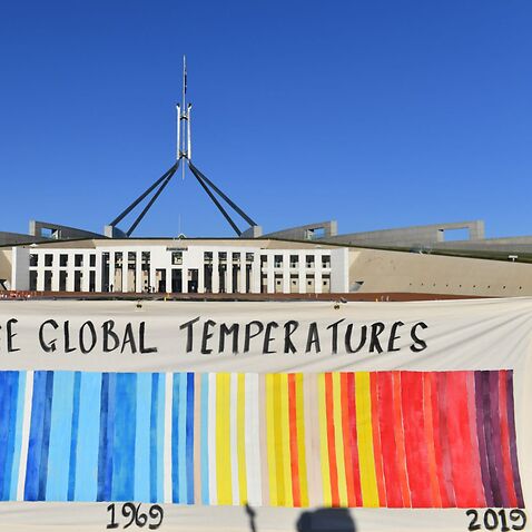 A banner depicting global temperatures by knitters fromthe Christian group Common Grace's Knit