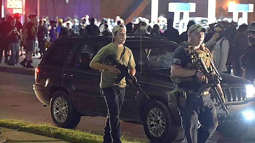 Kyle Rittenhouse is seen carrying a weapon during a night of unrest in Kenosha, Wisconsin, following the police shooting of Jacob Blake, 25 August, 2020.