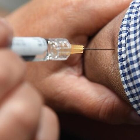 Image of a man receiving flu vaccination
