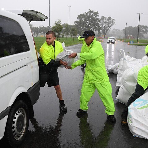 Penrith City Council workers load sand bags into residents cars at Jamison Park in Sydney, Wednesday, March 2nd, 2022. A developing east coast low is beginning to impact Sydney with heavy rain that could cause flash flooding and potentially hazardous cond