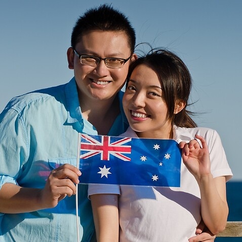 Aussie Asian couple with Australian flag
