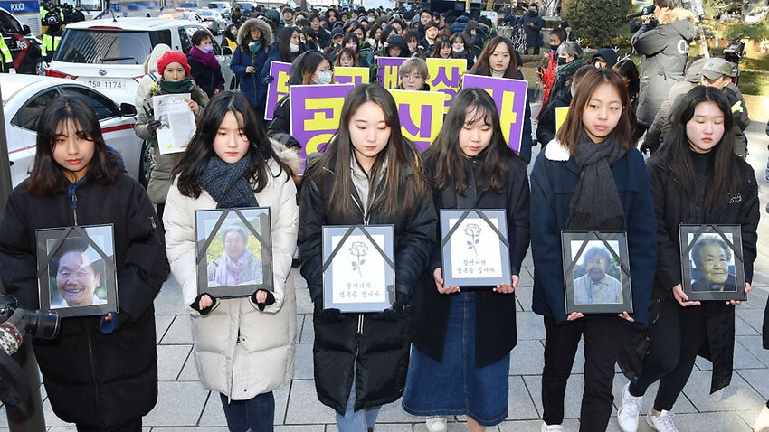 People take part in a protest rally in Seoul for comfort women.