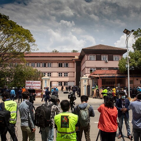 Media gather outside the Supreme Court in Kathmandu, Nepal.