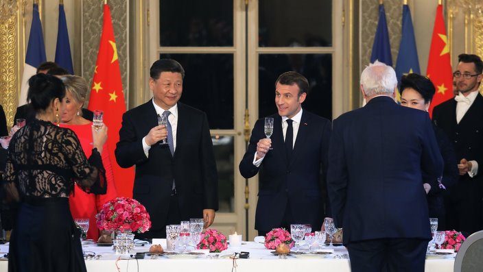 French President Emmanuel Macron (R) and Chinese President Xi Jinping toast each other during a state dinner at the Elysee Palace in Paris, France, on 25 March 2019, as part of a Chinese state visit to France.