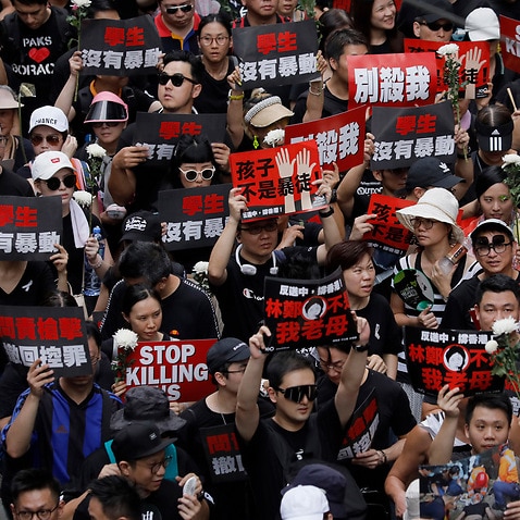 Protesters march on the streets against an extradition bill in Hong Kong.
