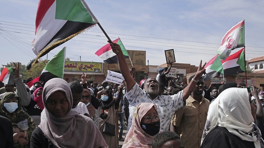 People chant slogans during a protest to denounce the October 2021 military coup, in Khartoum, Sudan.
