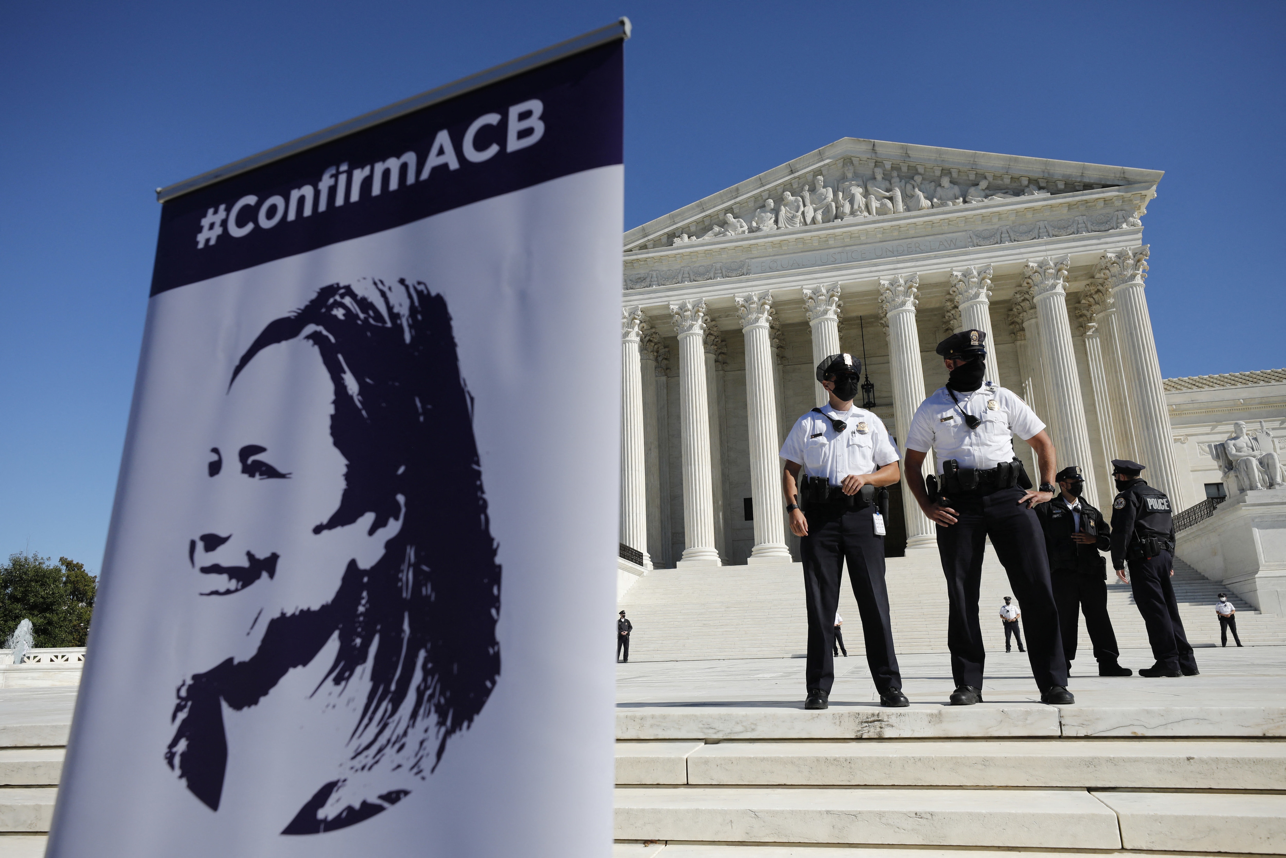 A poster with Judge Amy Coney Barrett is seen outside US Supreme Court during the Women's March in Washington on October 17, 2020.