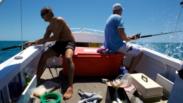 Two men in a boat, fishing
