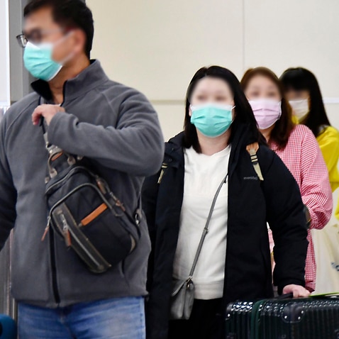 Travellers have donned face masks in a bid to better protect themselves from the coronavirus.