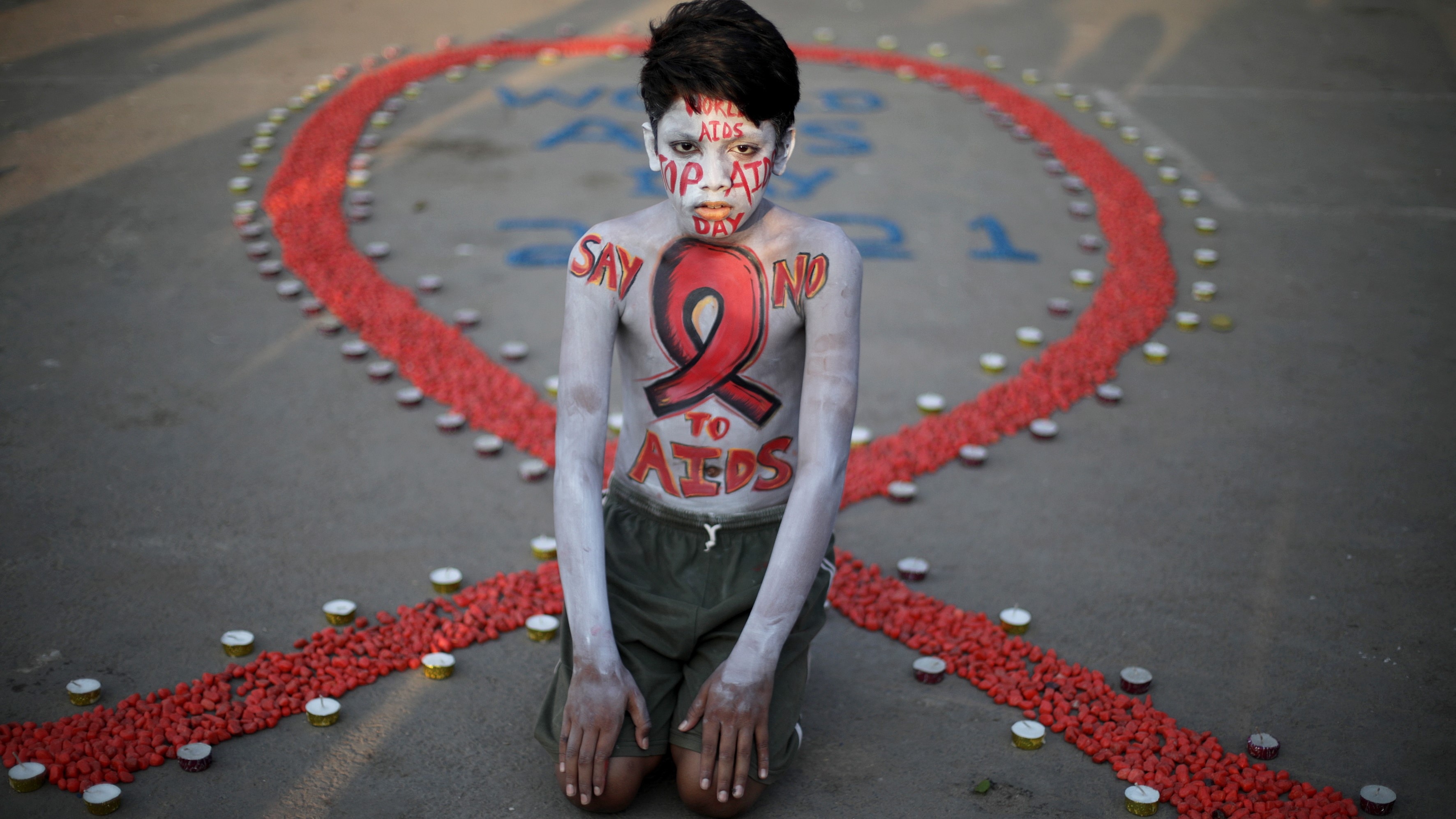An activist poses during a campaign to mark World AIDS Day in Kolkata, India, 1 December 2021