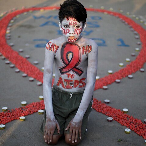 An activist poses during a campaign to mark World AIDS Day in Kolkata, India, 1 December 2021