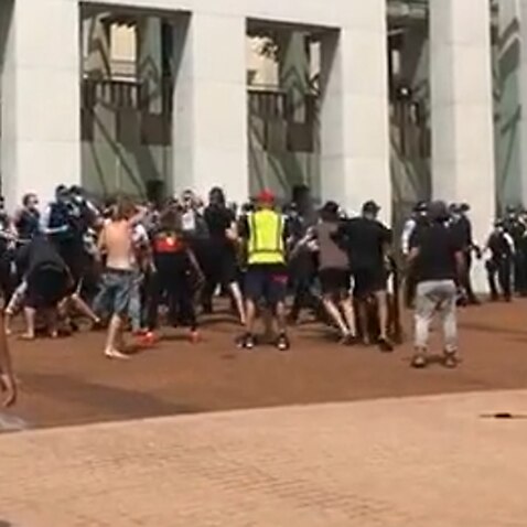 Police and protesters have clashed outside Parliament House in Canberra. 