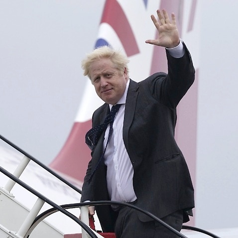 UK Prime Minister Boris Johnson boards a plane bound for Washington where he will meet with US President Joe Biden and Australian Prime Minister Scott Morrison.