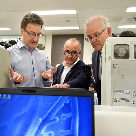 Victorian Deputy Premier James Merlino and Prime Minister Scott Morrison during a tour at the Peter Doherty Institute for Infection and Immunity in Melbourne.