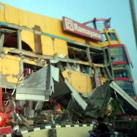 A collapsed shopping mall after a 7.7 magnitude earthquake that hit in Donggala, Central Sulawesi, Indonesia.