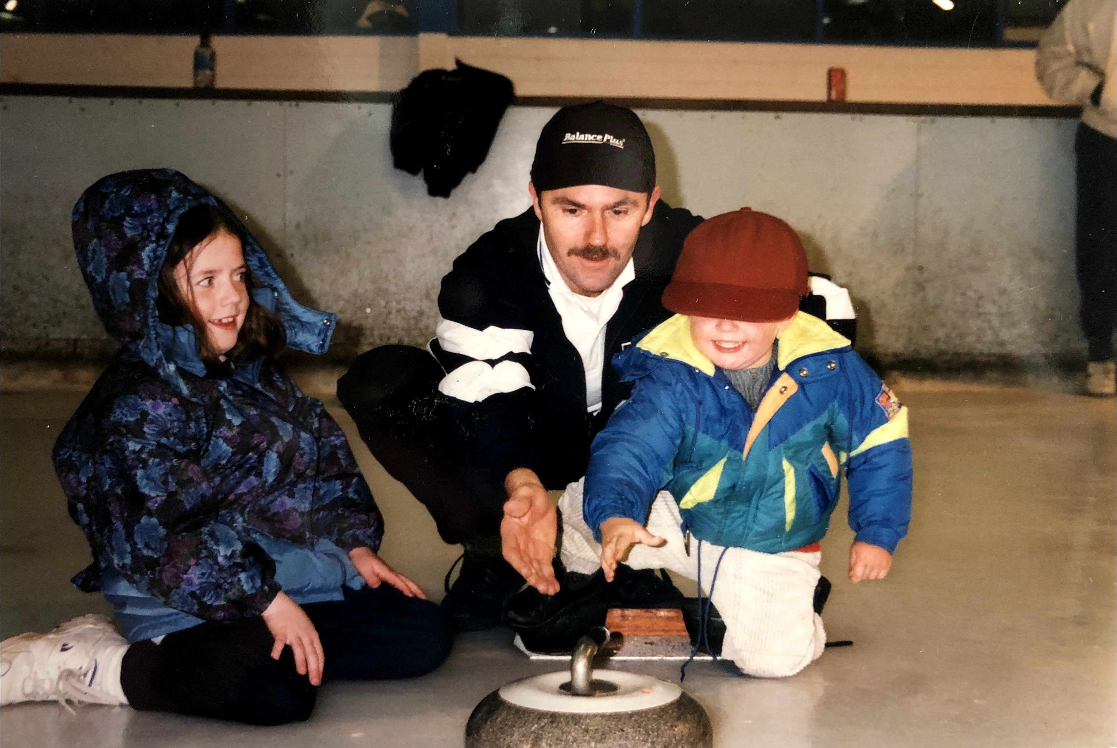Dean, aged 5 (left) curling with his dad (center).