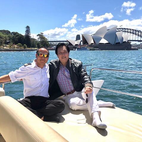 Steven Zhang (left) and Chinese movie star Tang Guoqiang on his yacht.