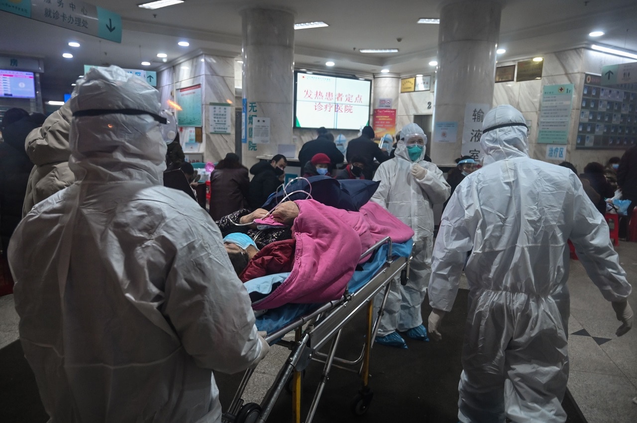 Medical staff with a patient at the Wuhan Red Cross Hospital.