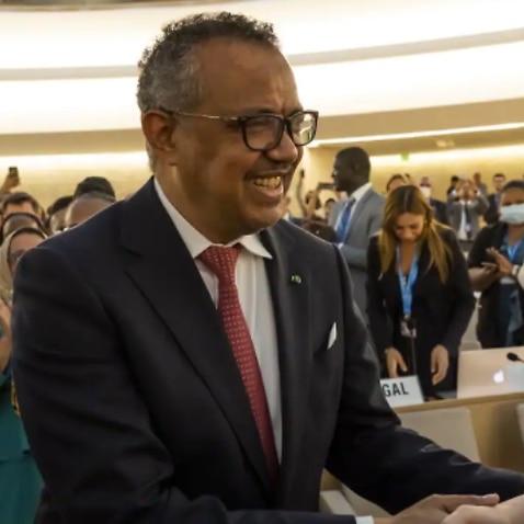 Dr Tedros Adhanom Ghebreyesus, Director-General of the World Health Organization (WHO) is congratulated by delegates after his reelection, during the 75th World Health Assembly at the European headquarters of the United Nations in Geneva, Switzerland, 24 