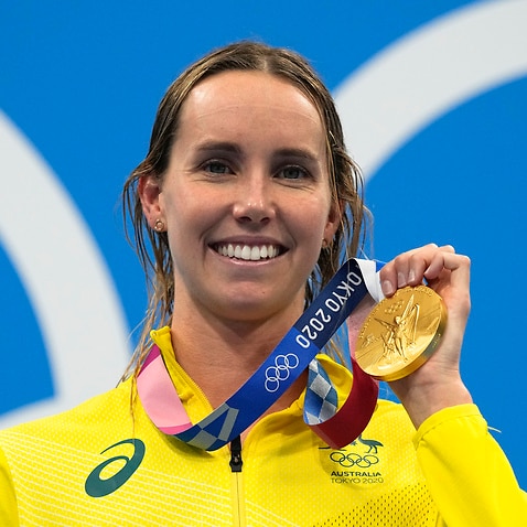 Emma McKeon poses after winning the gold medal in the women's 50m freestyle final at the 2020 Olympics, Sunday, Aug. 1, 2021