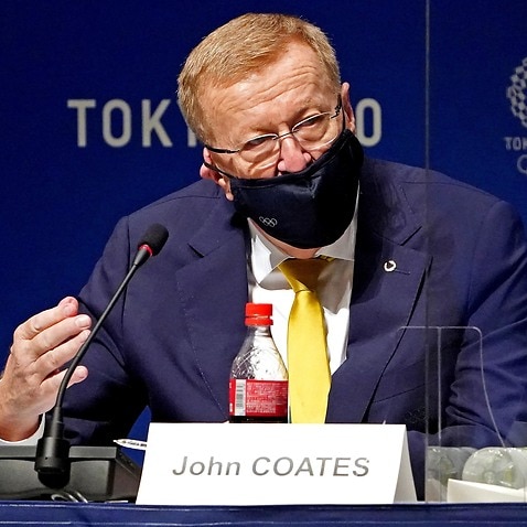 AOC member John Coates speaks during a press conference in Tokyo 