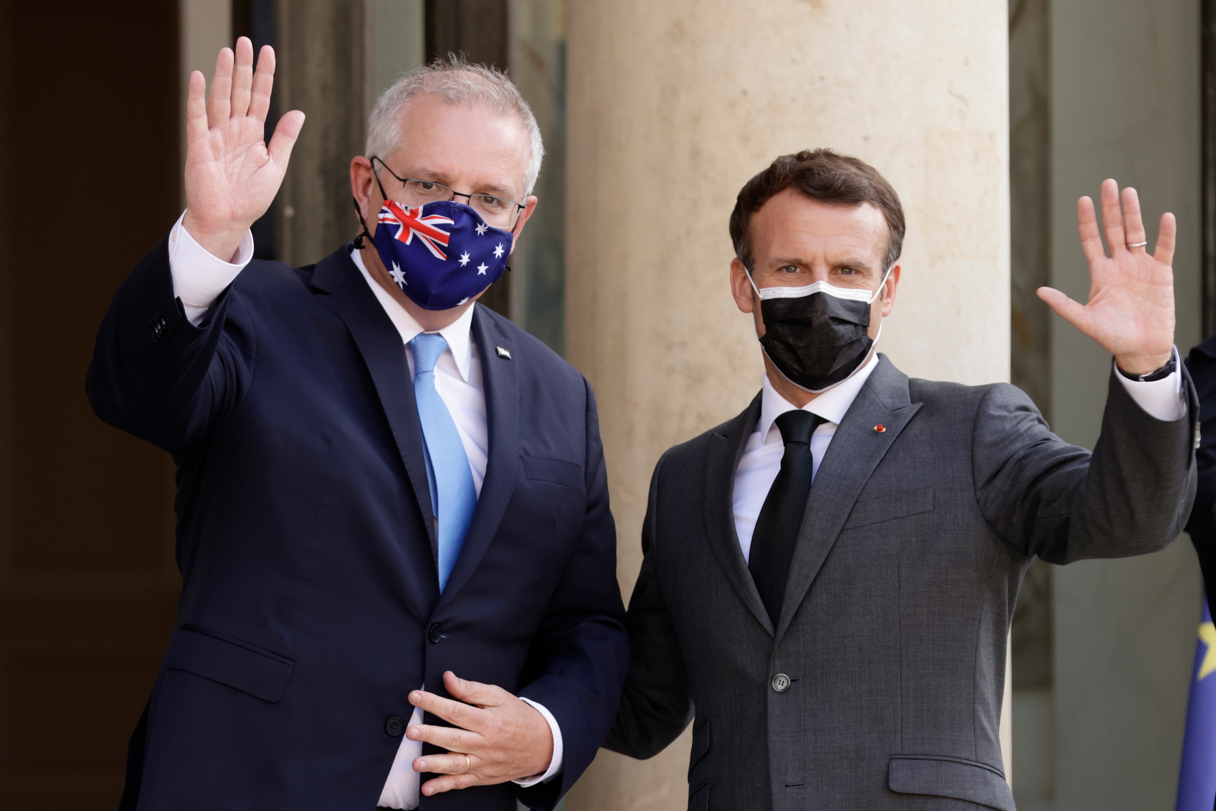 French President Emmanuel Macron greets Australian Prime Minister Scott Morrison upon his arrival at the Elysee Palace in Paris in June.